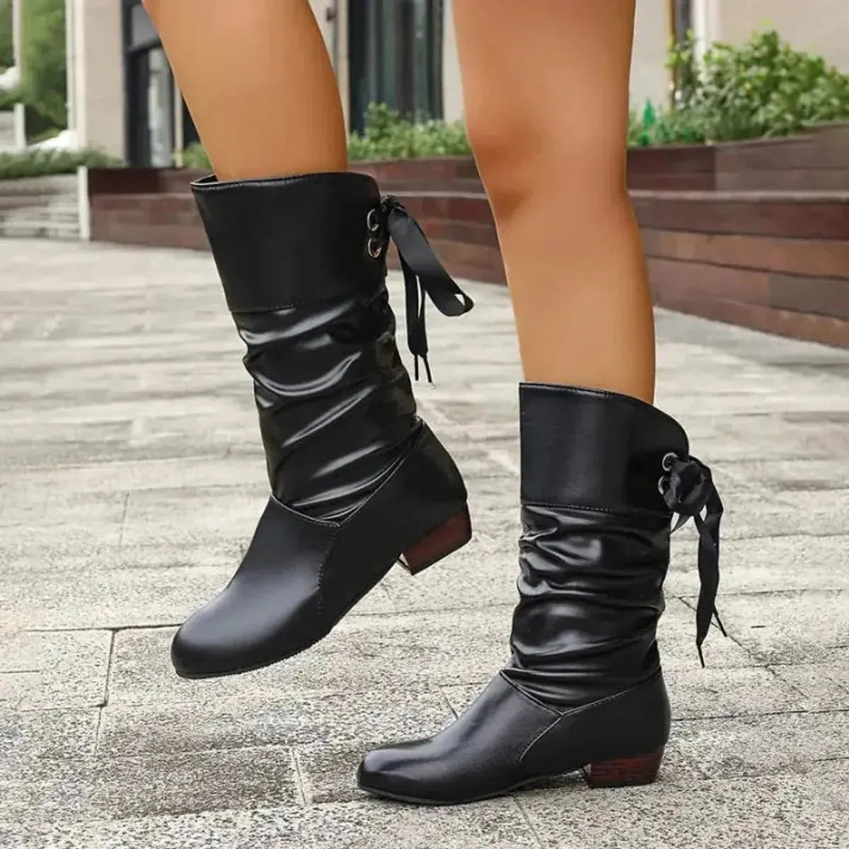 Black Women's Block Heel Boots in Slouchy Faux Leather with Lace-Up Ankle Tie — Lana - Front Walking