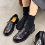 Black single strap with buckle Women's Brogue Loafers with Fringed Kiltie & Cushioned Footbed - Flat Lay With Socks