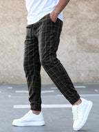 Men's Windowpane Plaid Trousers with Drawstring Waist & Tapered Fit - Side Profile Walking