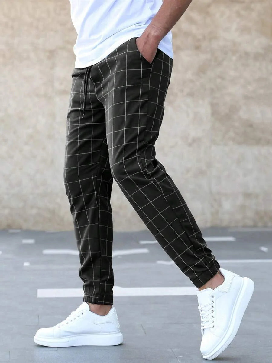 Men's Windowpane Plaid Trousers with Drawstring Waist & Tapered Fit - Side Profile Walking