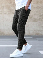 Men's Windowpane Plaid Trousers with Drawstring Waist & Tapered Fit - Side Walking Motion