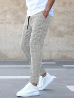 Men's Windowpane Plaid Trousers with Drawstring Waist & Tapered Fit - Side Pose Close