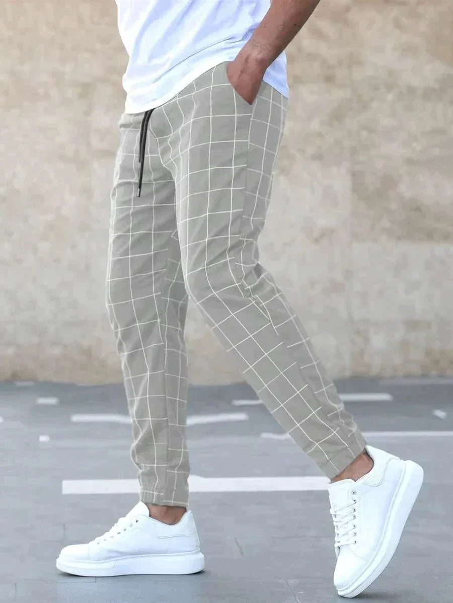 Men's Windowpane Plaid Trousers with Drawstring Waist & Tapered Fit - Side Walking Pose