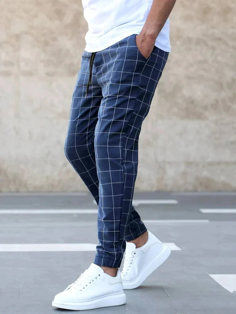 Men's Windowpane Plaid Trousers with Drawstring Waist & Tapered Fit - Side Walking Pose