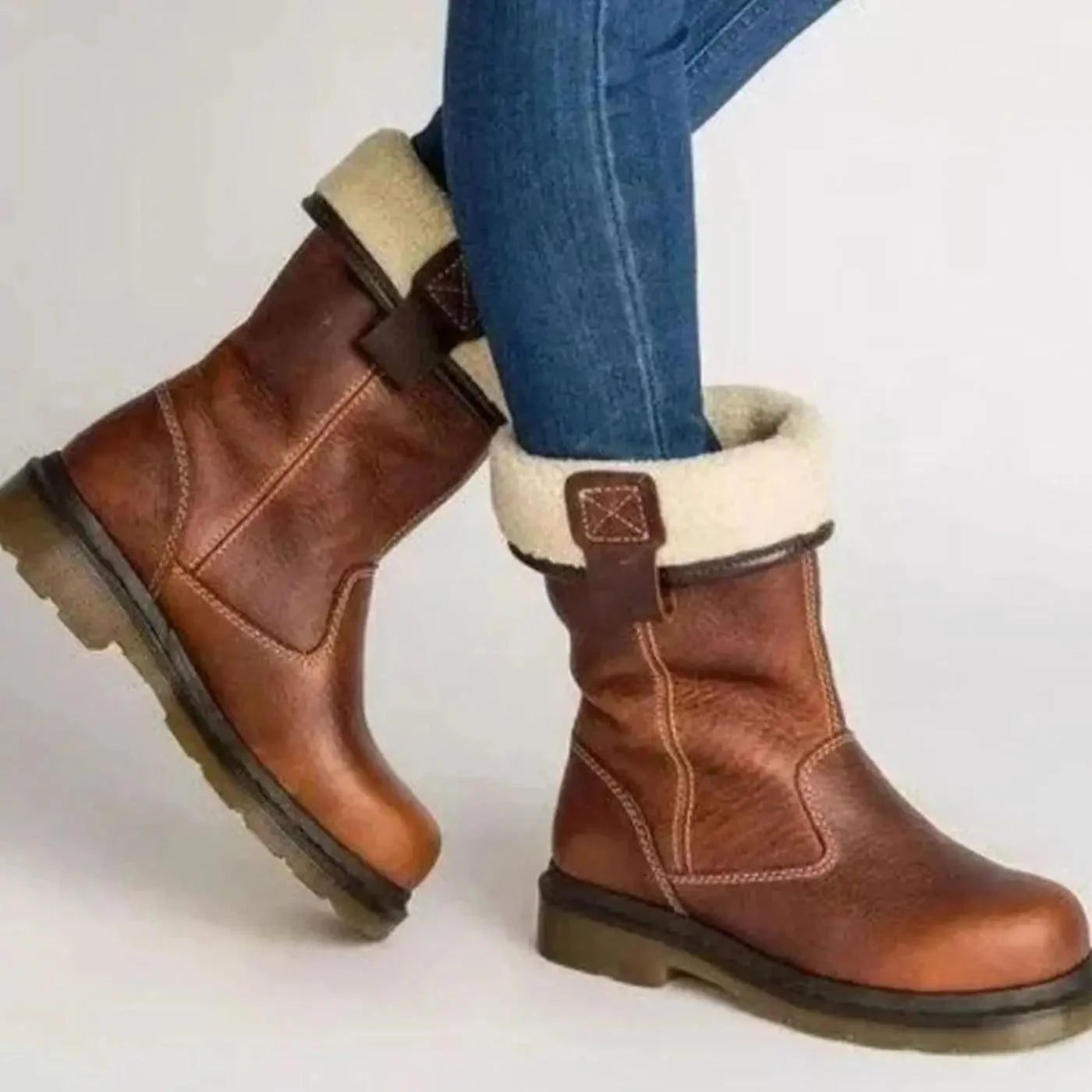 Brown Women's Fleece-Lined Leather Winter Boots with Slip-On Design - Side Pose Walking