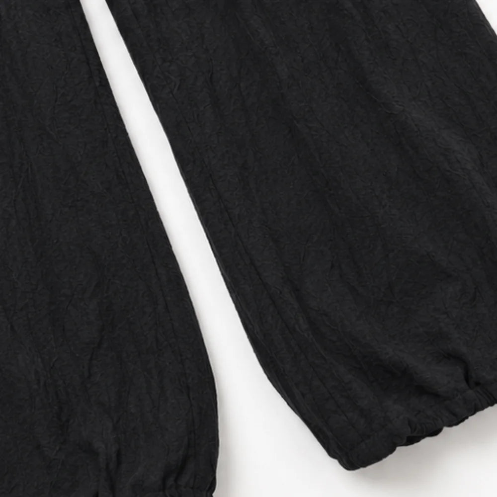 Black Women's Halter Cowl-Neck Wide-Leg Jumpsuit with Elastic Waist & Pockets — Dolly - Close Up Hem Cuff