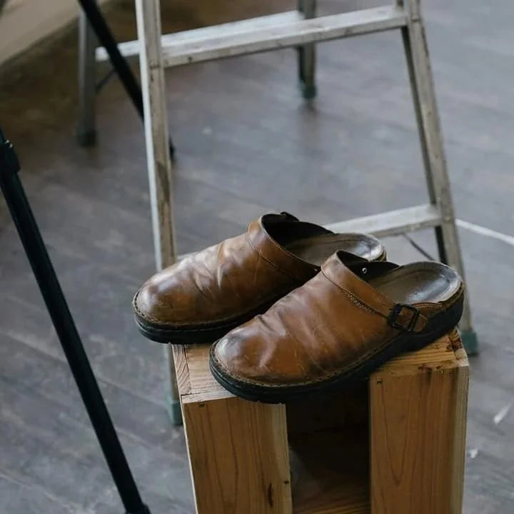 Men's Leather Mules with Buckle Strap & Round Toe - Worn Lifestyle Stool