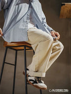 Beige Men's Classic Sneakers with Lace-Up Closure & Colorblock Design - Seated Lifestyle