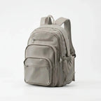 Beige Nylon Multi Pocket Backpack with Adjustable Mesh Straps - Studio Front Angle