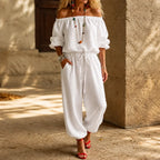 White Women's Off Shoulder Jumpsuit with Puff Sleeves & Relaxed Wide-Leg Fit — Brittany - Front Full Doorway