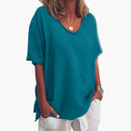 Ocean Blue Women's Oversized V-Neck Short Sleeve Blouse with Curved Hem - Front Closeup