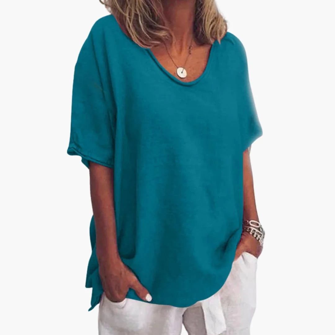 Ocean Blue Women's Oversized V-Neck Short Sleeve Blouse with Curved Hem - Front Closeup
