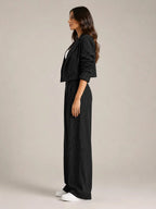Black Women's Two-Piece Blazer Set with Pinstripe Cropped Jacket & Wide-Leg Pants — Claire - Side Pose