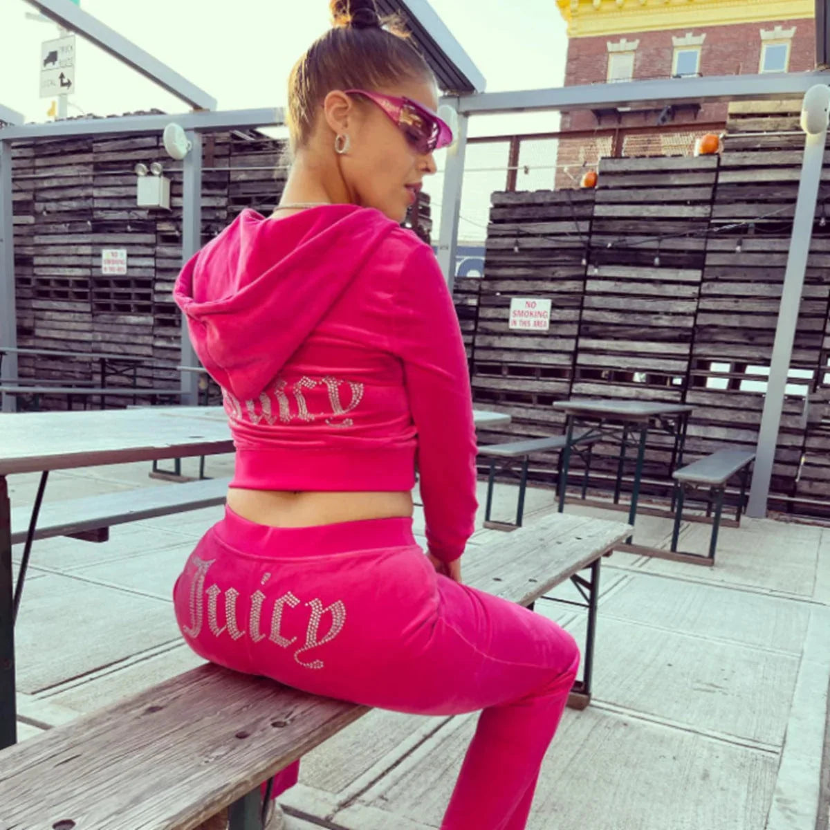 Magenta Women's Velour Tracksuit with Cropped Zip Jacket & Rhinestone Logo - Side Seated Bench