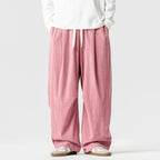 Pink Men's Wide-Leg Corduroy Pants with Drawstring & Pleated Relaxed Fit - Front Standing